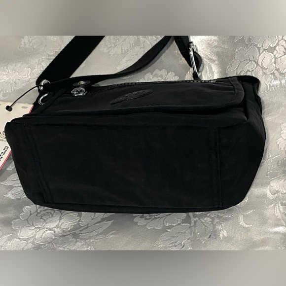 Kipling Sabian Crossbody Mini Bag In Black
Approx. 7.75" W x 5.75" H x 3.25" D - Picture 5 of 7